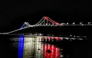 Bridge lit up Red, White, and Blue with Olympia's lights
